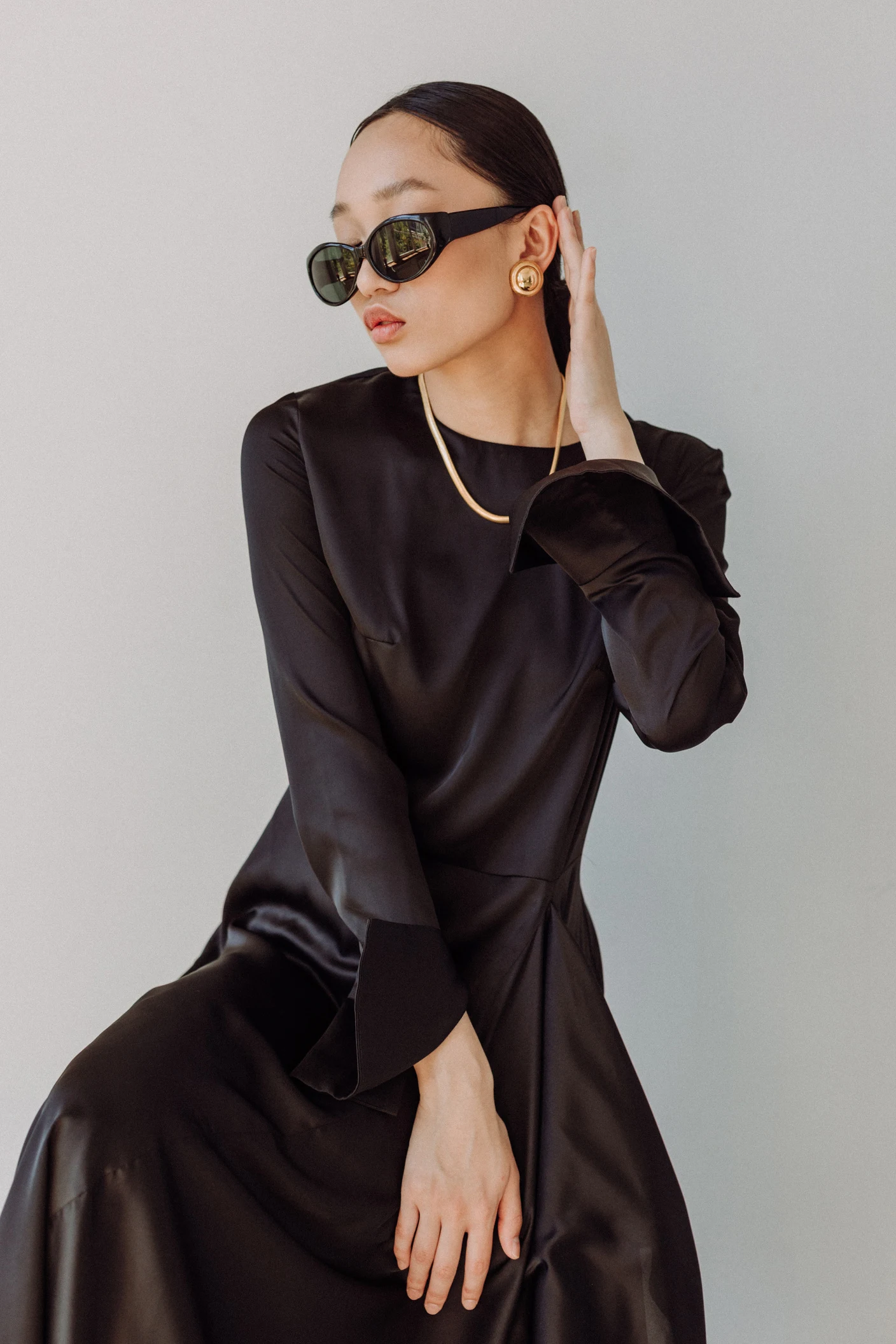Fashion portrait of a model wearing a black tailored outfit